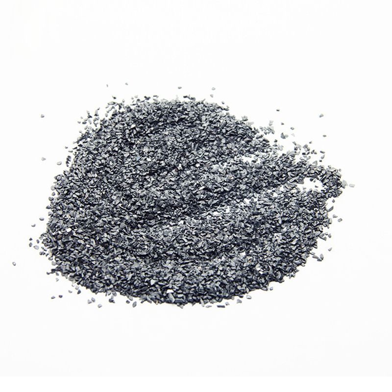 How does the particle size distribution of tungsten particles affect its performance?